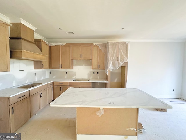 kitchen with crown molding, a center island, and black electric stovetop