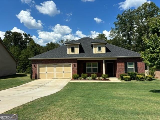 view of front facade featuring a garage and a front yard