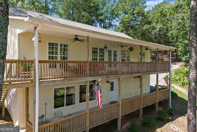 back of house with ceiling fan