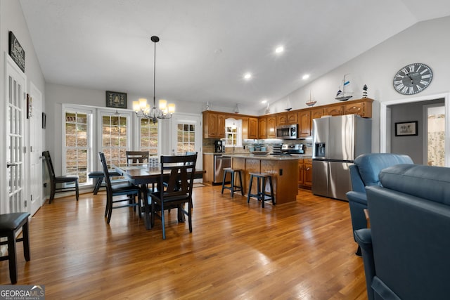 373 Pineywoods Dr, Wedowee, AL 36278 - dining room featuring lofted ceiling, recessed lighting, wood finished floors, and a chandelier