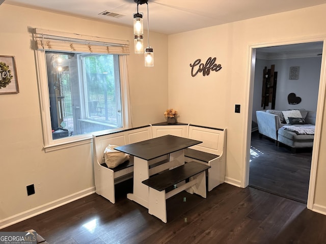 dining area with dark hardwood / wood-style flooring