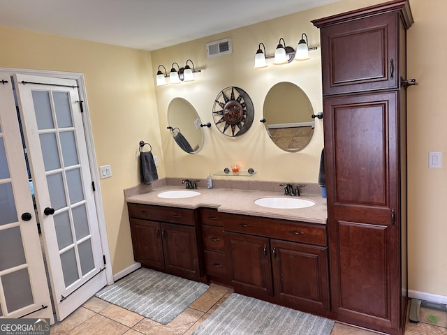 bathroom featuring tile patterned floors and vanity