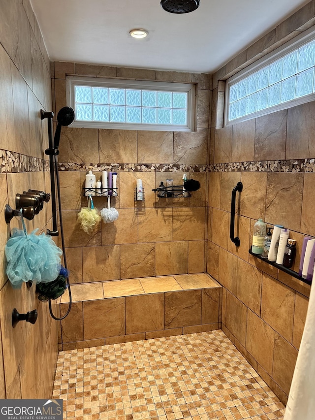 bathroom featuring a tile shower