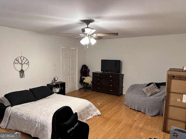 bedroom with ceiling fan and light hardwood / wood-style floors