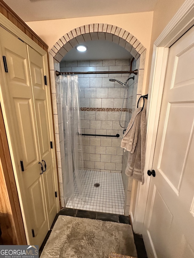 bathroom with a shower with curtain