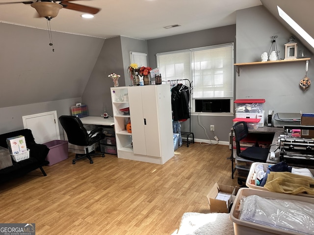 office area featuring vaulted ceiling and light hardwood / wood-style floors