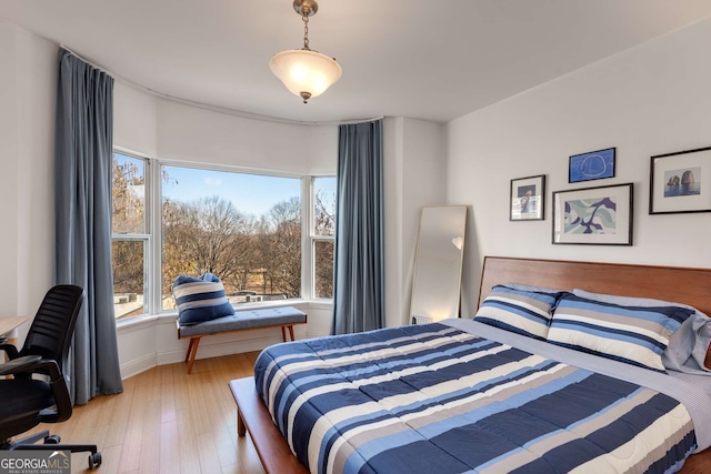 bedroom with light wood-type flooring