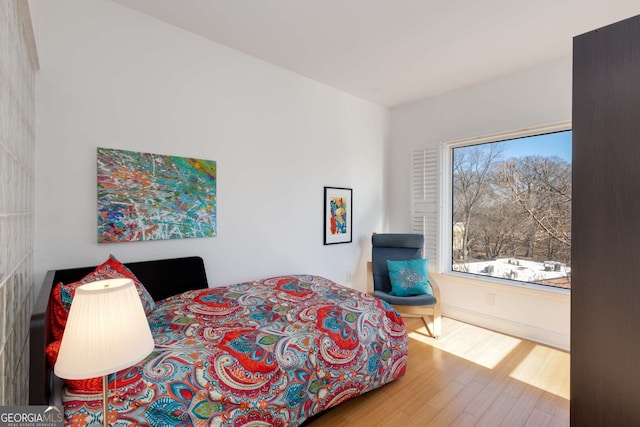 bedroom featuring wood-type flooring