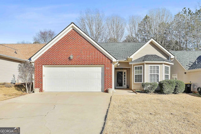 ranch-style house with a garage and a front yard