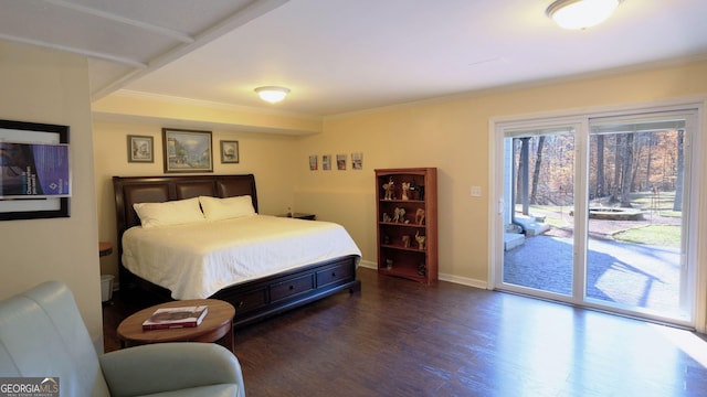 bedroom featuring ornamental molding, dark hardwood / wood-style flooring, and access to outside