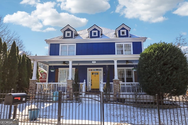 view of front of home with ceiling fan and covered porch