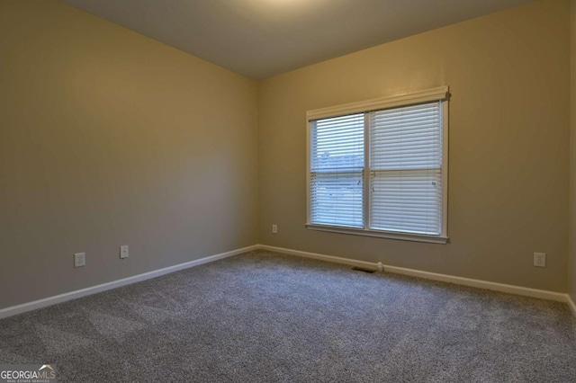 empty room with carpet flooring