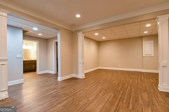 basement featuring hardwood / wood-style floors and a paneled ceiling