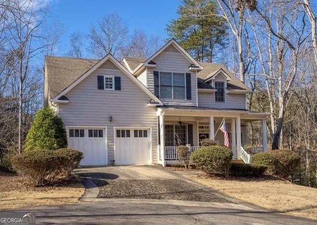 view of front of house with a garage and a porch