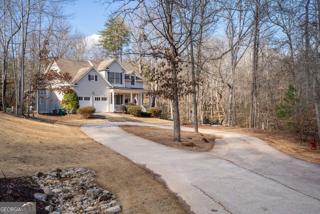 view of front of house with a garage and covered porch