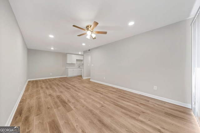 interior space featuring ceiling fan and light hardwood / wood-style floors