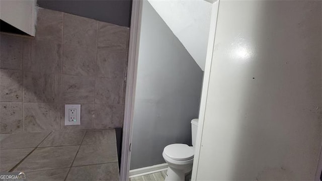 bathroom featuring tile patterned floors and toilet