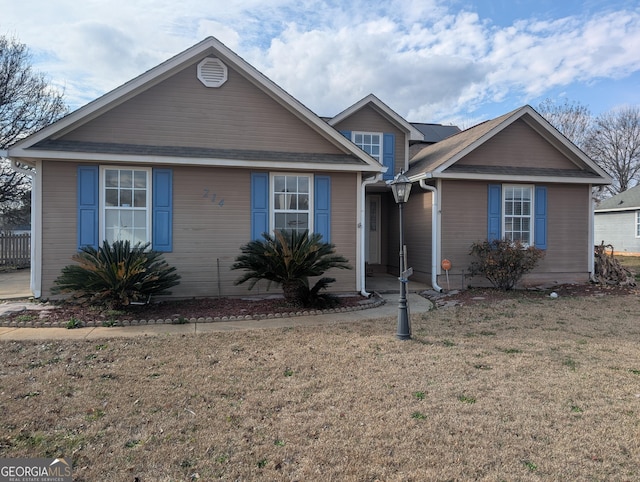 view of front of home with a front yard