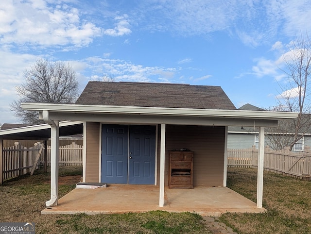 view of outbuilding with a lawn