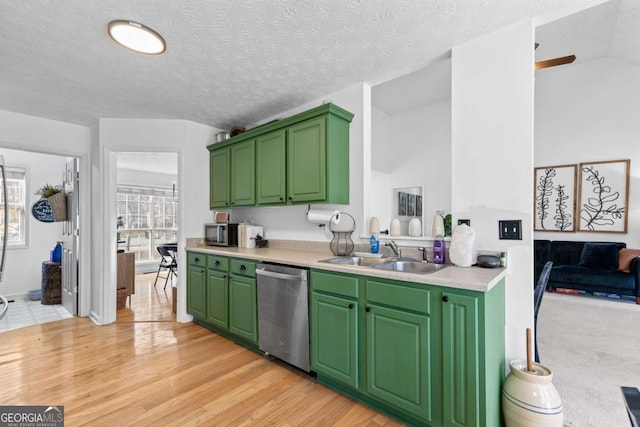 kitchen featuring sink, dishwasher, and green cabinets