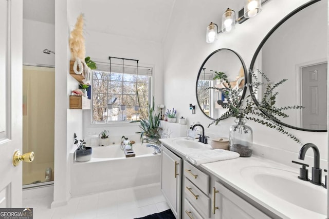 bathroom featuring vanity, shower with separate bathtub, and tile patterned flooring