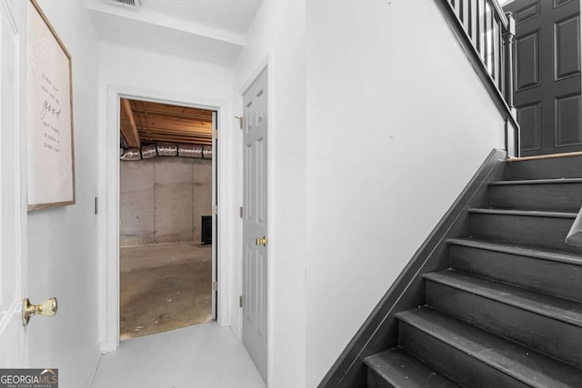 stairway with concrete floors