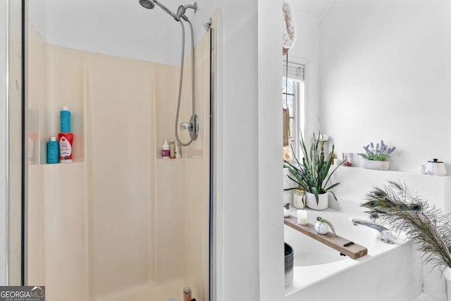 bathroom featuring an enclosed shower