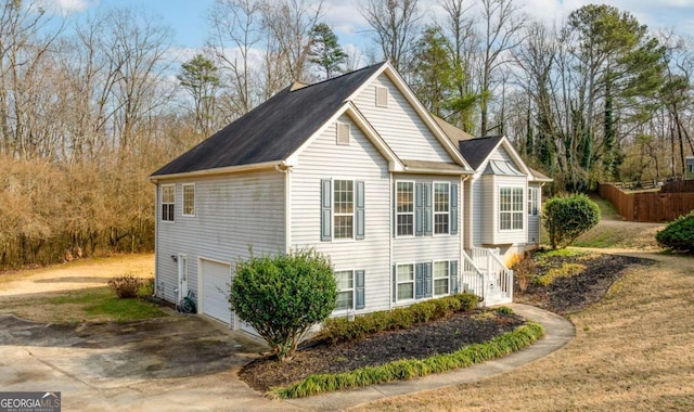 view of side of home featuring a garage