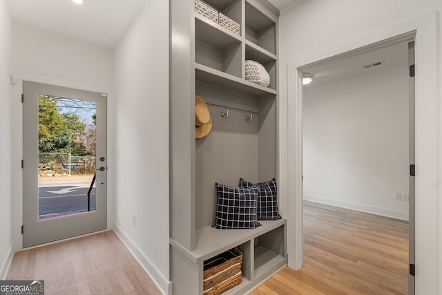 mudroom with light hardwood / wood-style flooring