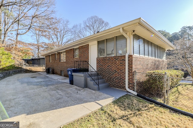 view of front of property featuring central air condition unit