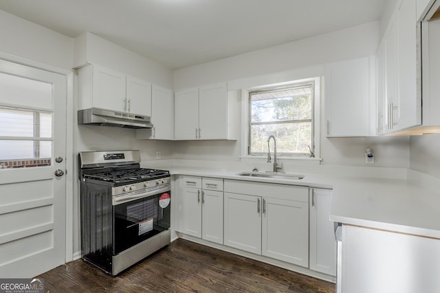 kitchen with white cabinetry, stainless steel range with gas stovetop, dark hardwood / wood-style flooring, and sink