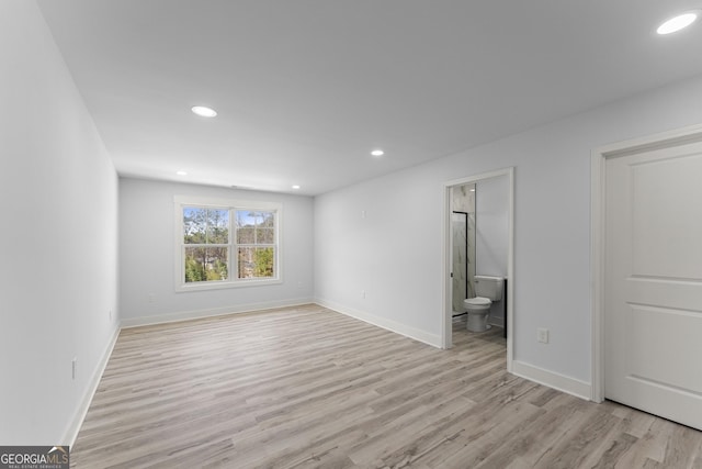 spare room featuring light hardwood / wood-style floors