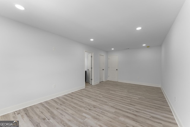 unfurnished room with light hardwood / wood-style floors