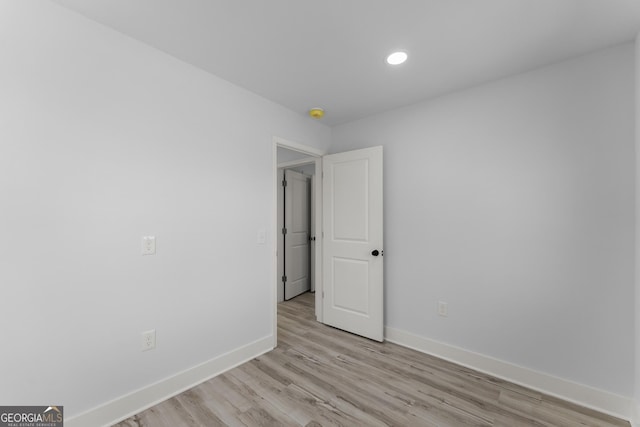 empty room with light hardwood / wood-style floors