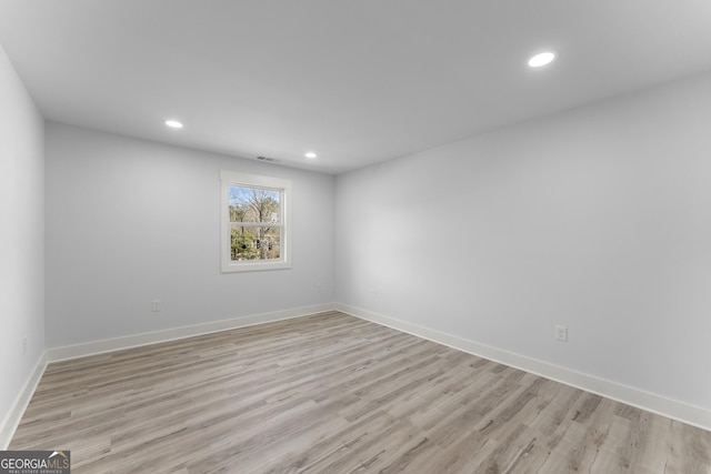 unfurnished room with light hardwood / wood-style flooring