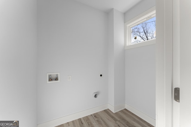 laundry room with hookup for a washing machine, hardwood / wood-style floors, and electric dryer hookup