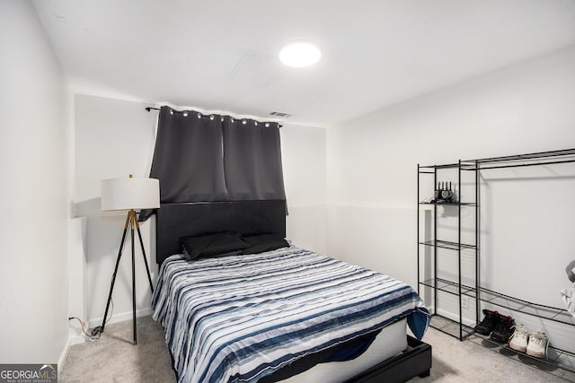 bedroom with light colored carpet