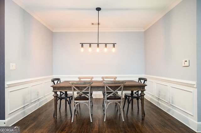 dining room featuring dark wood-type flooring and ornamental molding