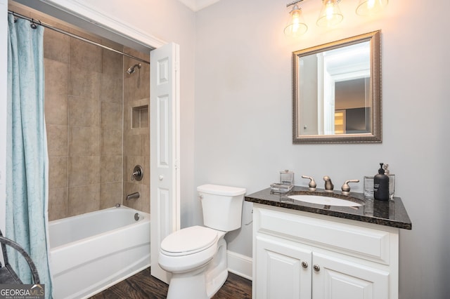 full bathroom with vanity, hardwood / wood-style flooring, shower / bath combination with curtain, and toilet