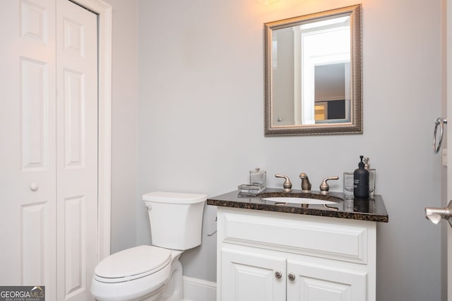 bathroom featuring vanity and toilet