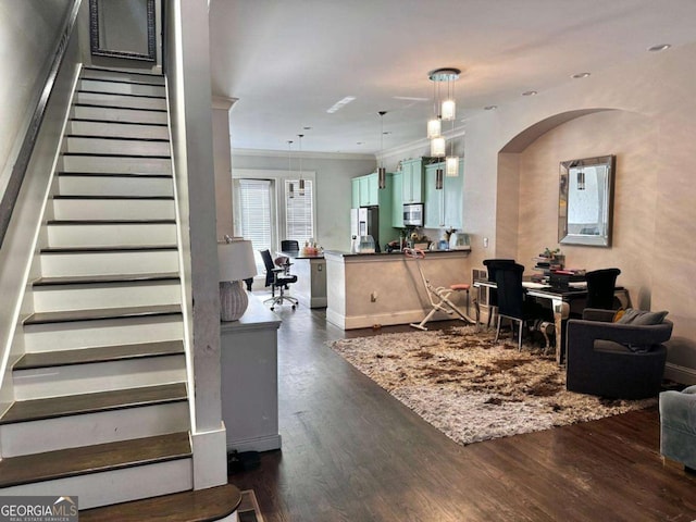 interior space featuring hardwood / wood-style flooring and ornamental molding