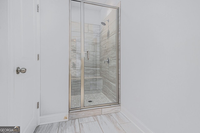 bathroom featuring an enclosed shower