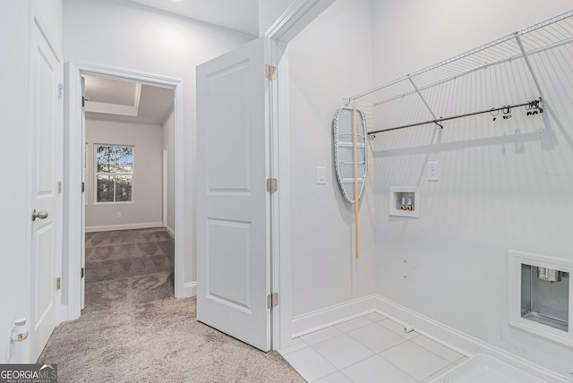 washroom with hookup for a washing machine and light colored carpet