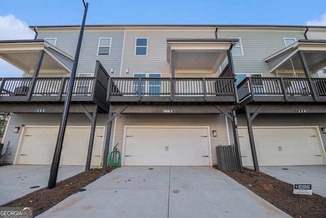 back of property with a garage