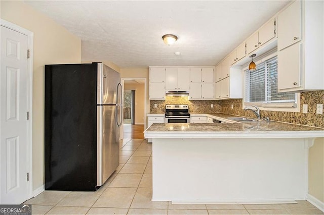 kitchen featuring appliances with stainless steel finishes, sink, white cabinets, and kitchen peninsula