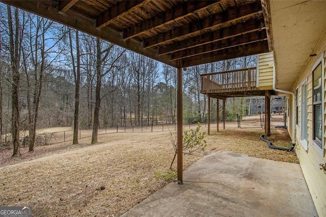 view of yard with a wooden deck and a patio area