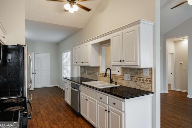 kitchen featuring lofted ceiling, sink, stainless steel appliances, and white cabinets