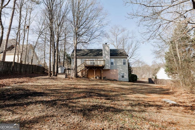 rear view of house with a wooden deck