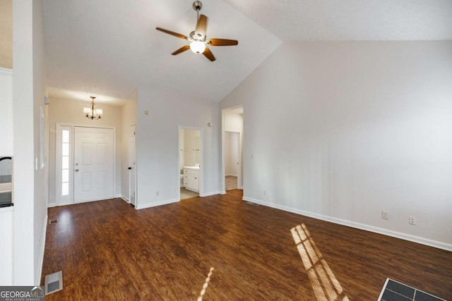 entrance foyer with dark hardwood / wood-style floors, ceiling fan with notable chandelier, and high vaulted ceiling