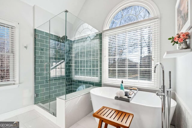 bathroom featuring separate shower and tub and tile patterned flooring